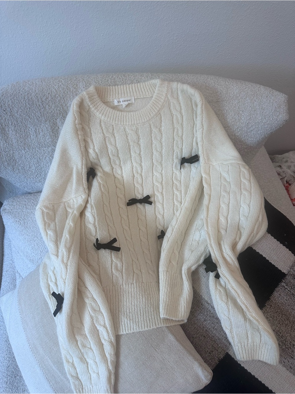 Cream Cable-Knit Sweater with Black Bows